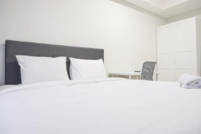 Fancy and Comfort 1BR at Gold Coast Apartment By Travelio